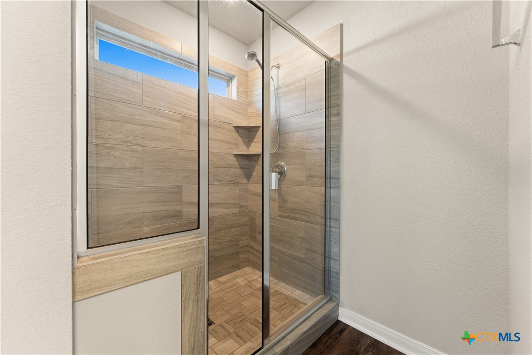 4124 Riata Ranch Road Waco, TX 76705 - Photo 11 of 20 Primary Walk-in Shower
