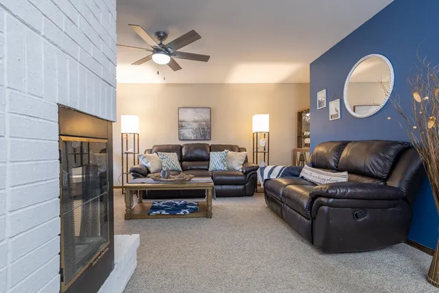 a living room with a couch and a chandelier