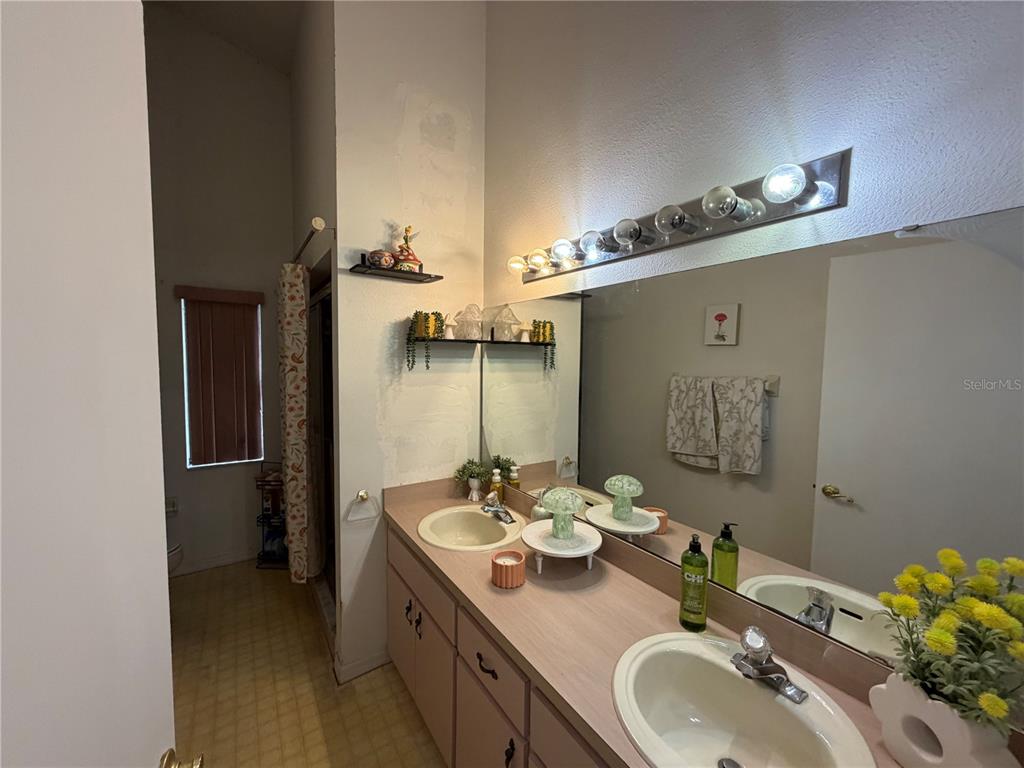 9 Hialeah Drive Ocala, FL 34482 - Photo 28 of 41 a bathroom with a sink double vanity granite and a mirror