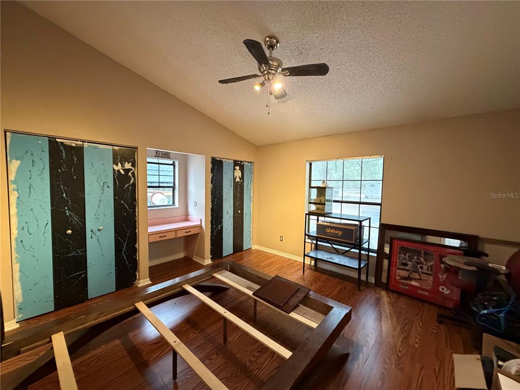9 Hialeah Drive Ocala, FL 34482 - Photo 29 of 41 a living room with furniture flat screen tv and a window