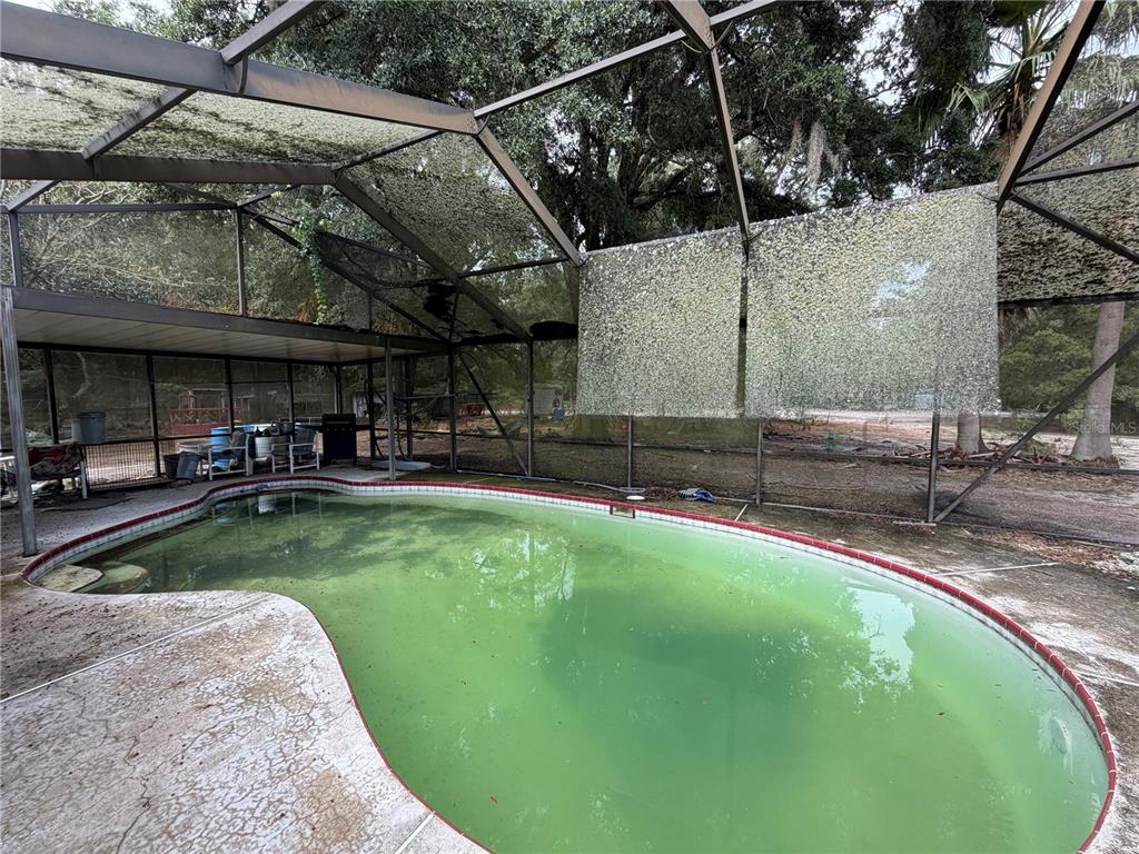 9 Hialeah Drive Ocala, FL 34482 - Photo 33 of 41 a view of a swimming pool with a patio