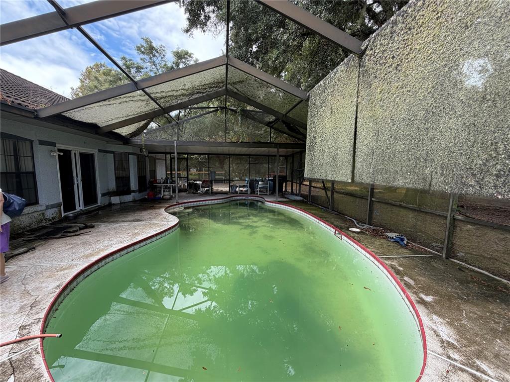 9 Hialeah Drive Ocala, FL 34482 - Photo 34 of 41 a swimming pool with outdoor seating and yard