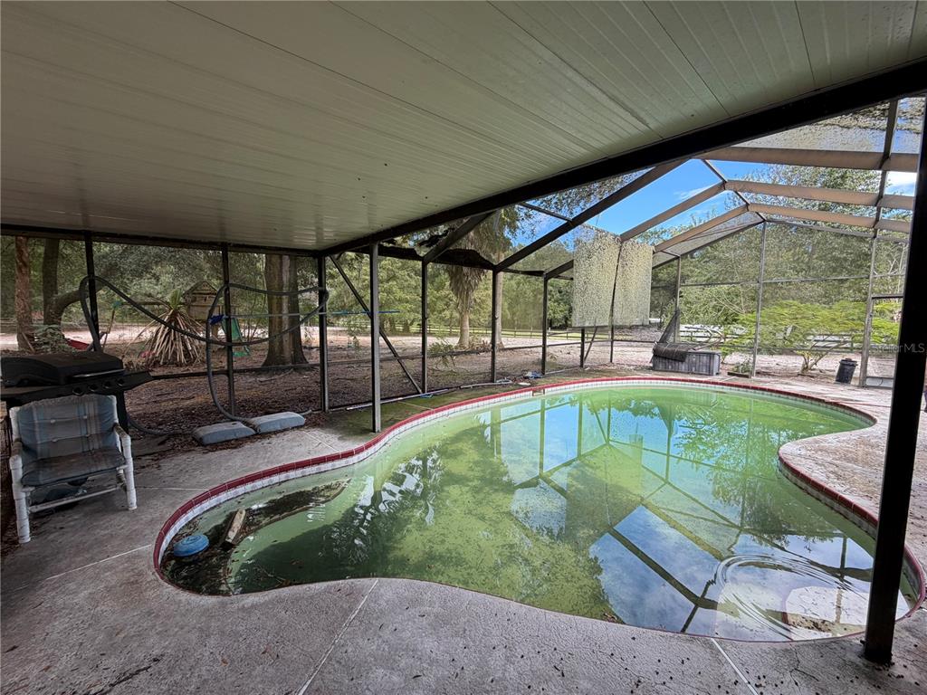 9 Hialeah Drive Ocala, FL 34482 - Photo 35 of 41 a swimming pool with patio outdoor seating and yard
