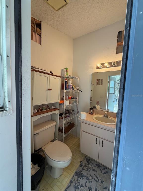 9 Hialeah Drive Ocala, FL 34482 - Photo 36 of 41 a bathroom with a toilet sink and mirror