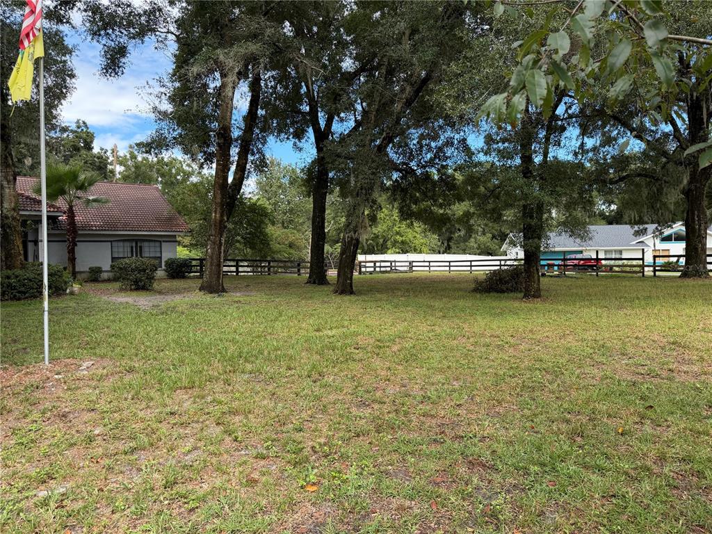9 Hialeah Drive Ocala, FL 34482 - Photo 5 of 41 a view of a garden with a bench