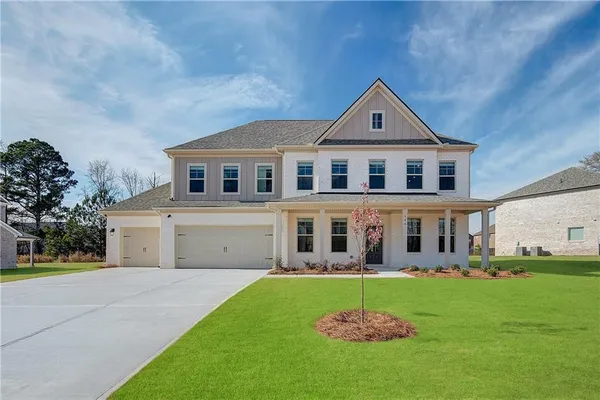 a front view of a house with a yard