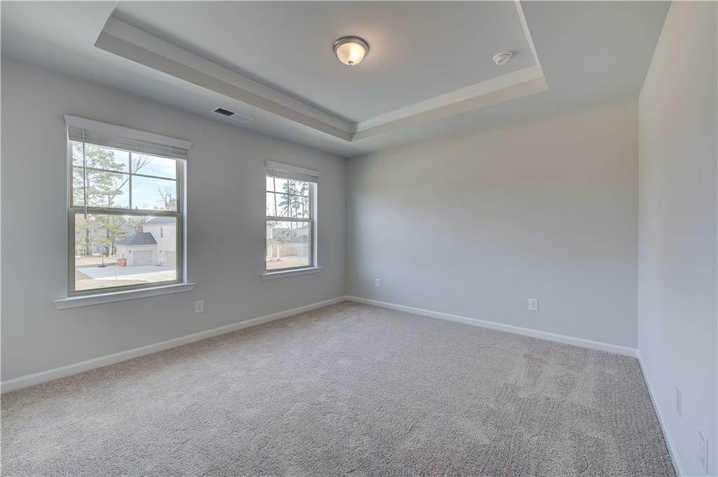 154 Haverling Pass Hampton, GA 30228 - Photo 24 of 36 an empty room with windows and closet