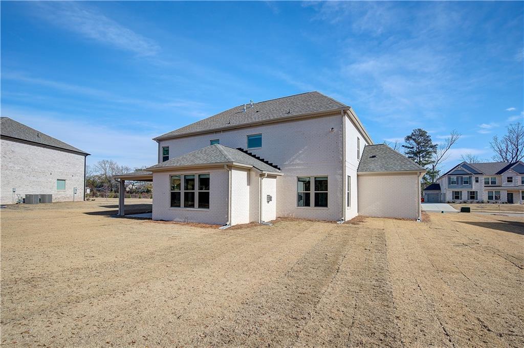 154 Haverling Pass Hampton, GA 30228 - Photo 35 of 36 a big house with a big yard and large trees