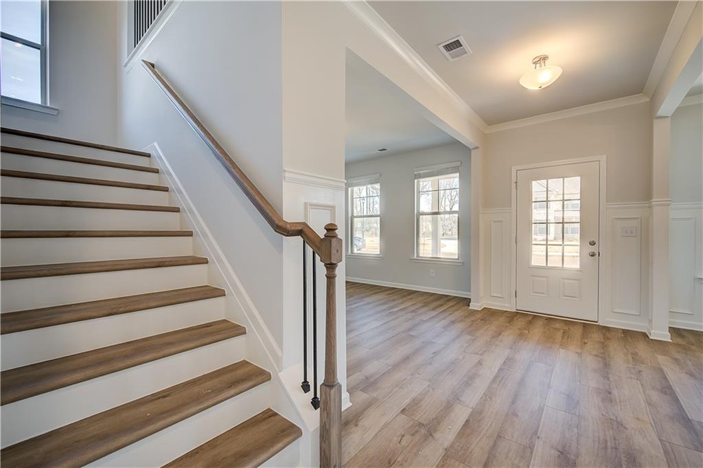 154 Haverling Pass Hampton, GA 30228 - Photo 7 of 36 a view of an entryway with wooden floor