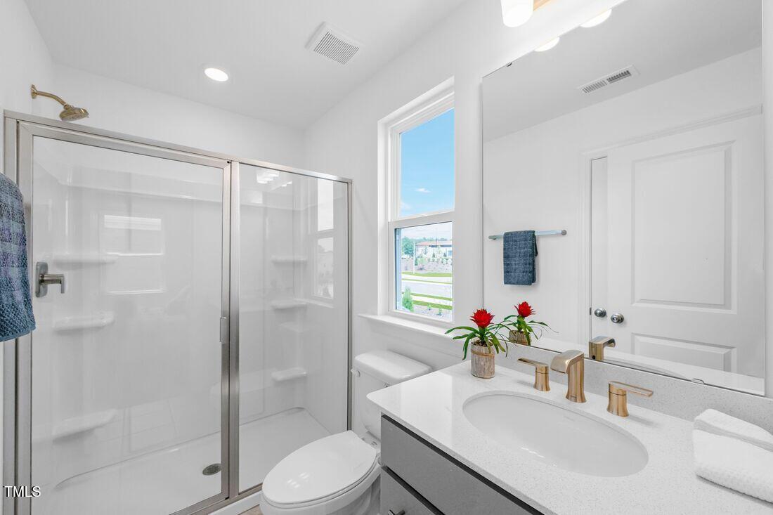 249 Tidal Pool Way Cary, NC 27519 - Photo 14 of 23 a bathroom with a sink toilet and shower