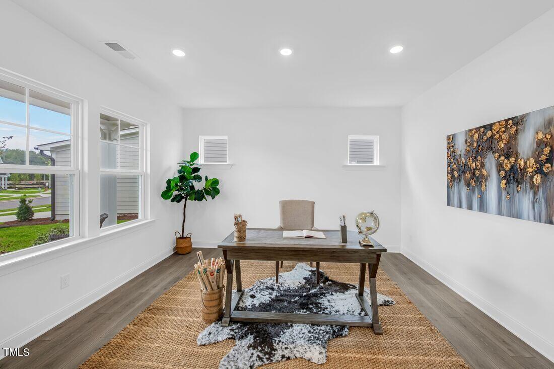 249 Tidal Pool Way Cary, NC 27519 - Photo 17 of 23 a living room with furniture and a potted plant