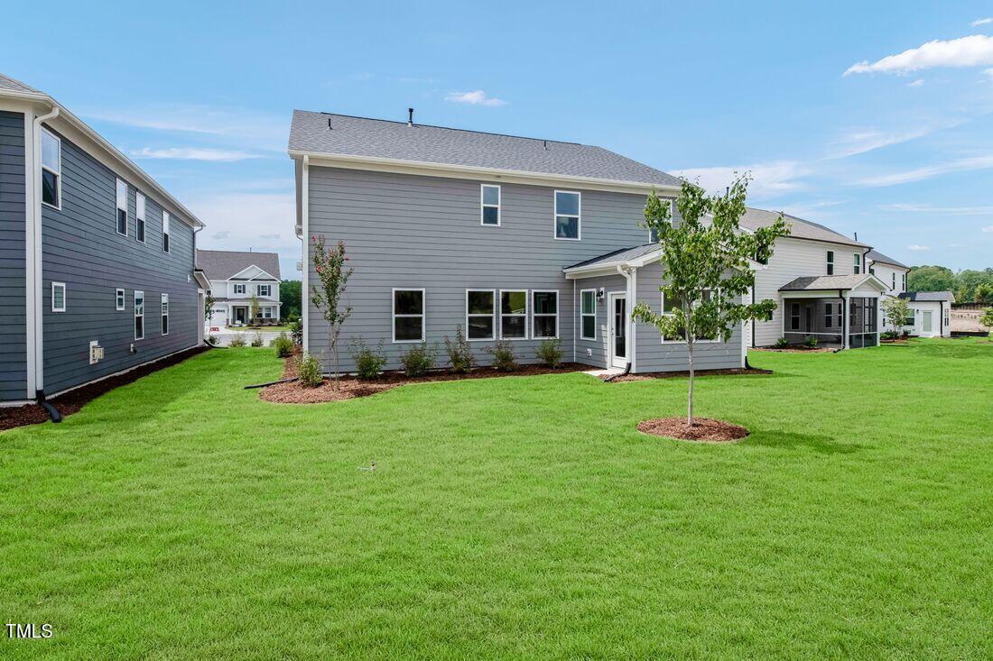 249 Tidal Pool Way Cary, NC 27519 - Photo 18 of 23 a view of an house with backyard space and garden