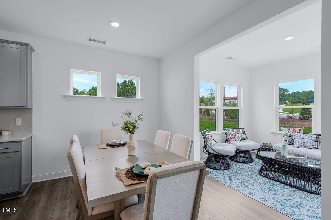 249 Tidal Pool Way Cary, NC 27519 - Photo 5 of 23 a living room with furniture and a large window