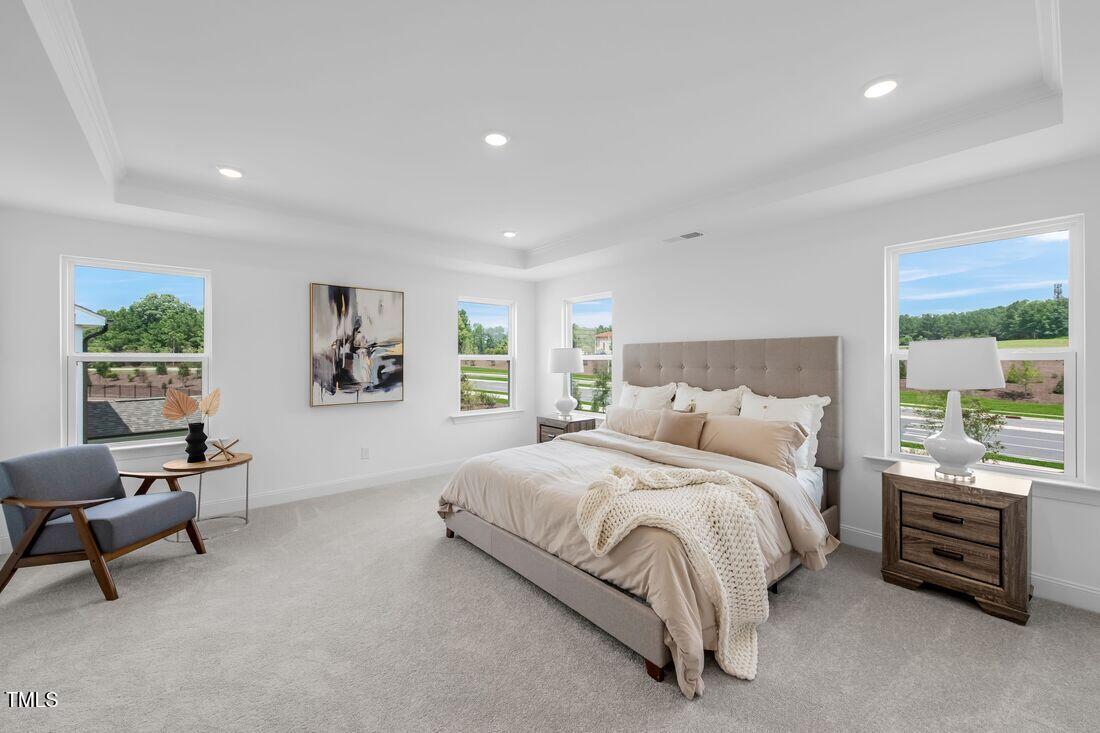 249 Tidal Pool Way Cary, NC 27519 - Photo 7 of 23 a bedroom with a bed and a couch