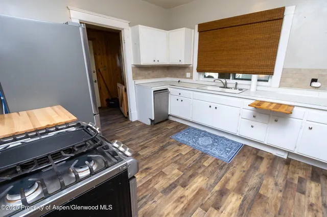 a kitchen with a stove and a sink