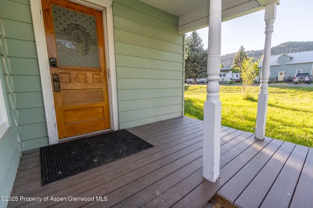 a view of a balcony with door
