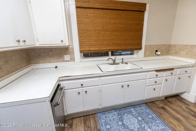 a bathroom with a double vanity sink and mirror
