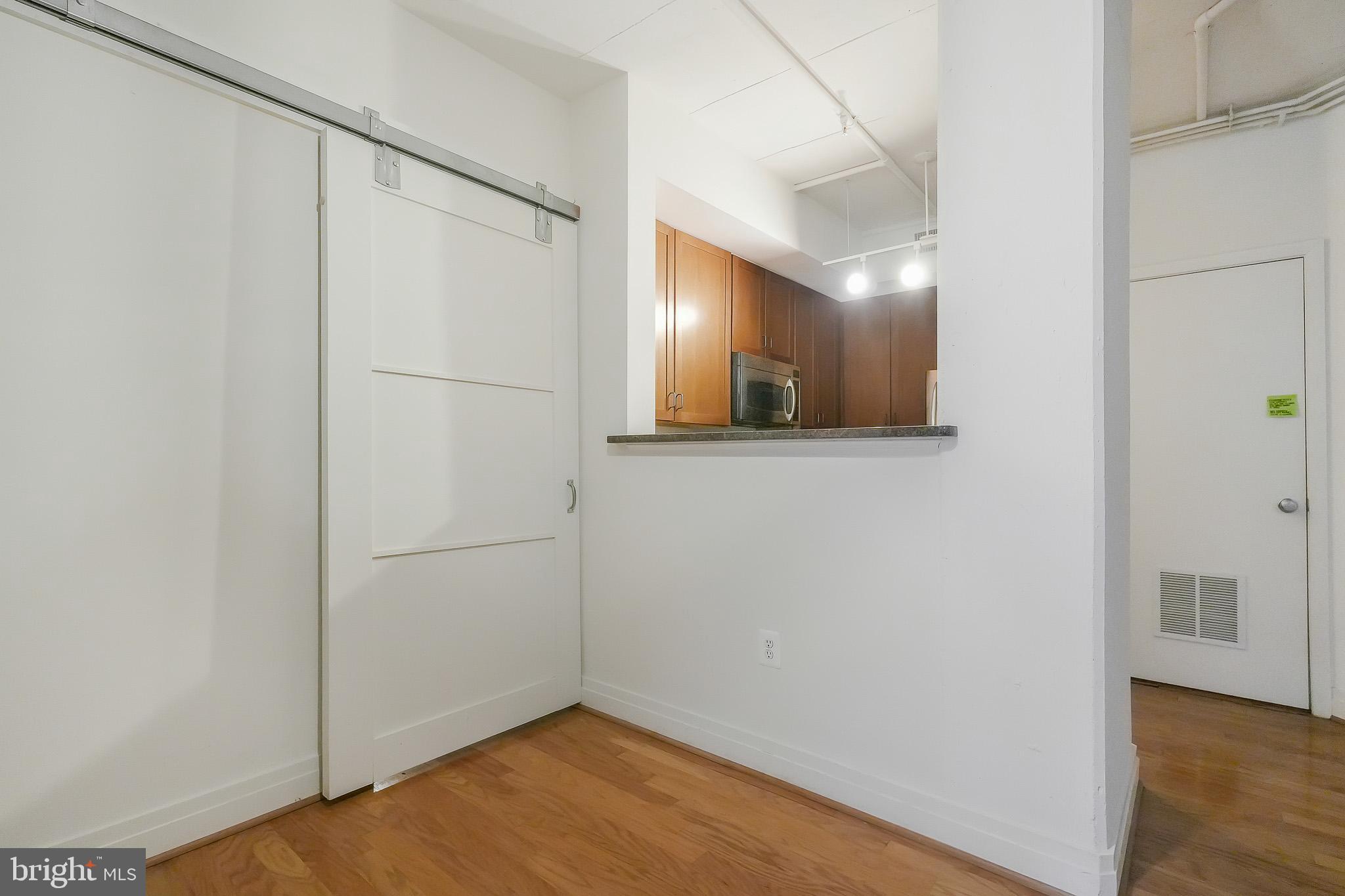 2020 12th Street Northwest, Unit T05 Washington, DC 20009 - Photo 16 of 38 a view of a small space with wooden floor