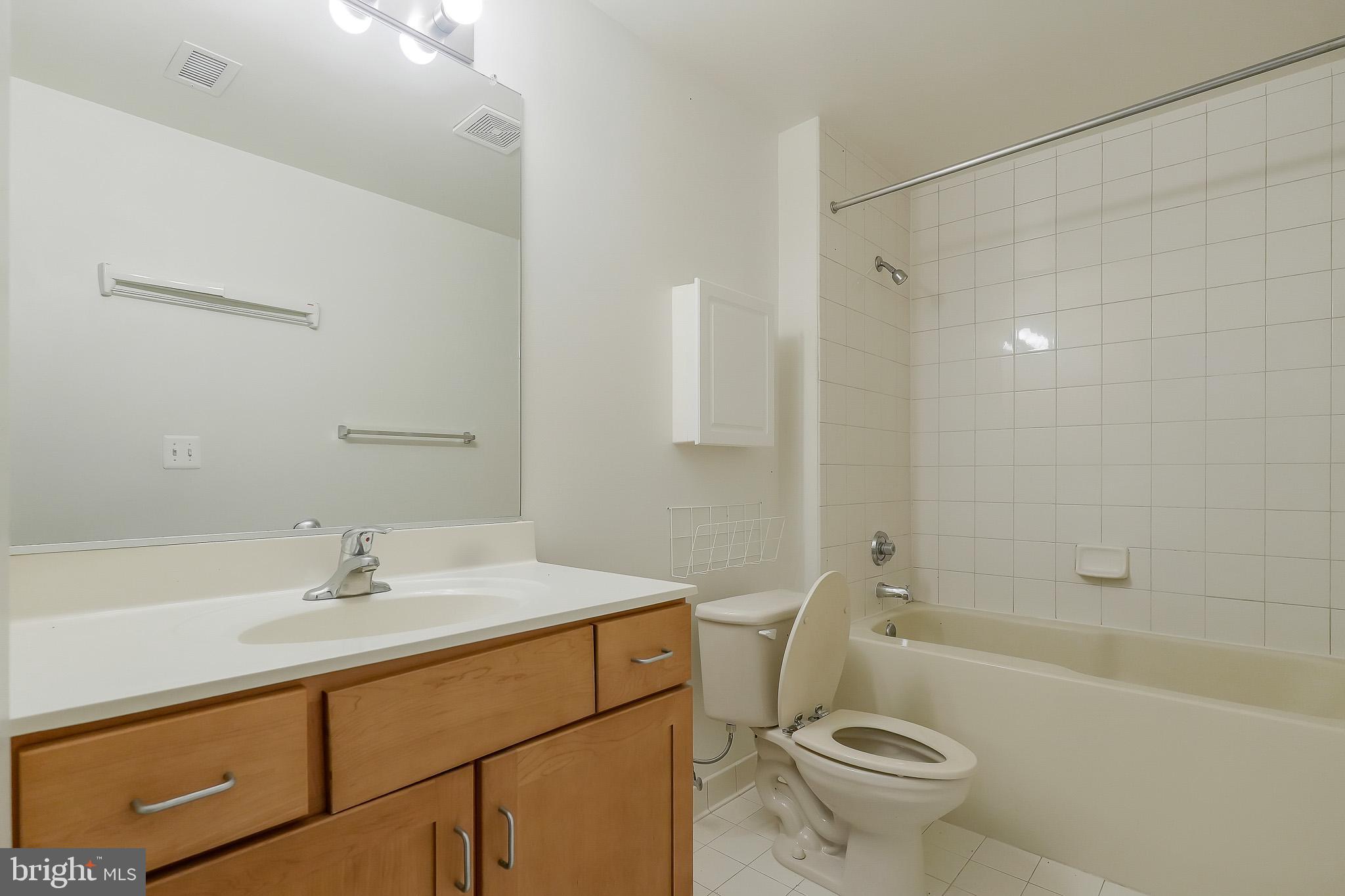 2020 12th Street Northwest, Unit T05 Washington, DC 20009 - Photo 19 of 38 a bathroom with a sink toilet and shower