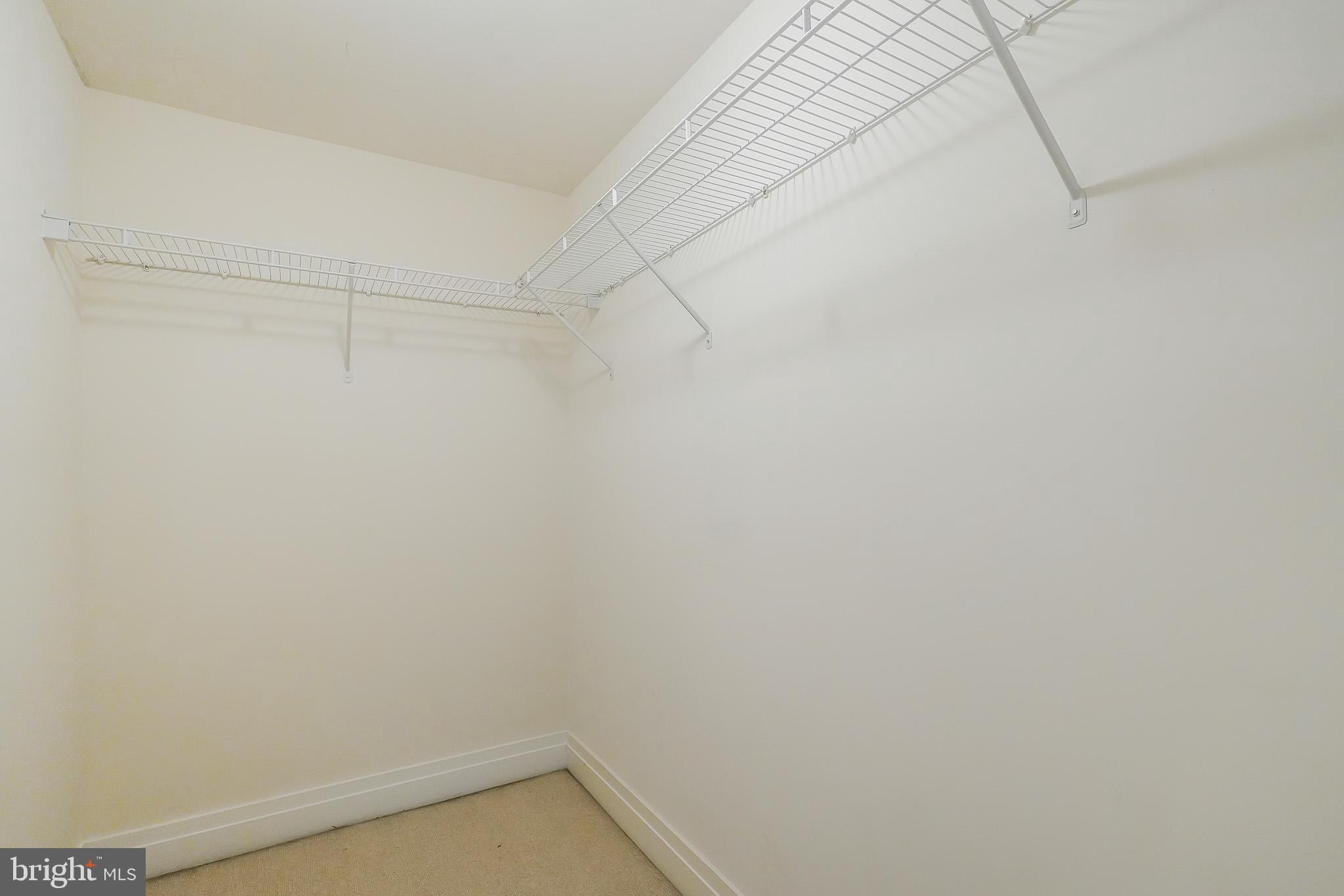 2020 12th Street Northwest, Unit T05 Washington, DC 20009 - Photo 20 of 38 a view of a room with racks on the wall