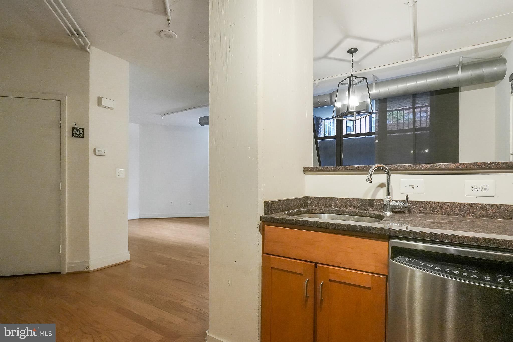 2020 12th Street Northwest, Unit T05 Washington, DC 20009 - Photo 30 of 38 a kitchen with a sink and a refrigerator