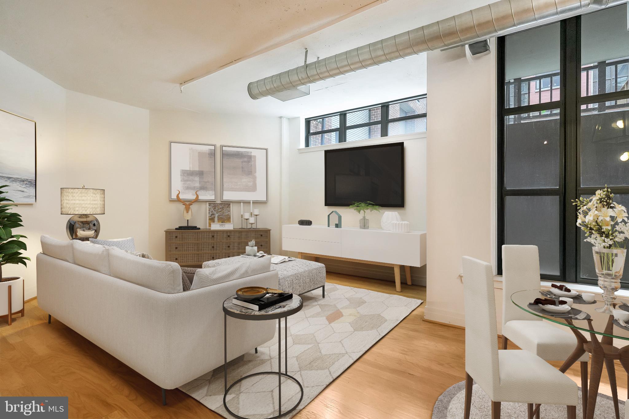 2020 12th Street Northwest, Unit T05 Washington, DC 20009 - Photo 10 of 38 a living room with furniture and a flat screen tv
