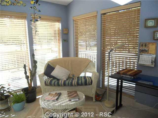 9580 Hardin Road Colorado Springs, CO 80908 - Photo 4 of 10 Passive Solar keeps the utilities low! Enjoy this spacious Sun Room