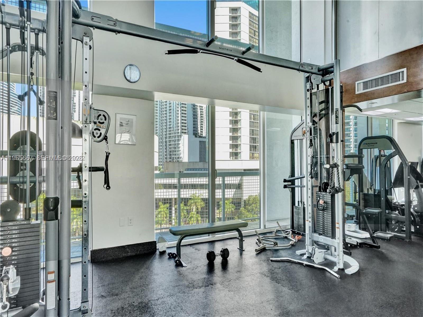 31 Southeast 5th Street, Unit 1110 Miami, FL 33131 - Photo 23 of 61 a view of a room with gym equipment