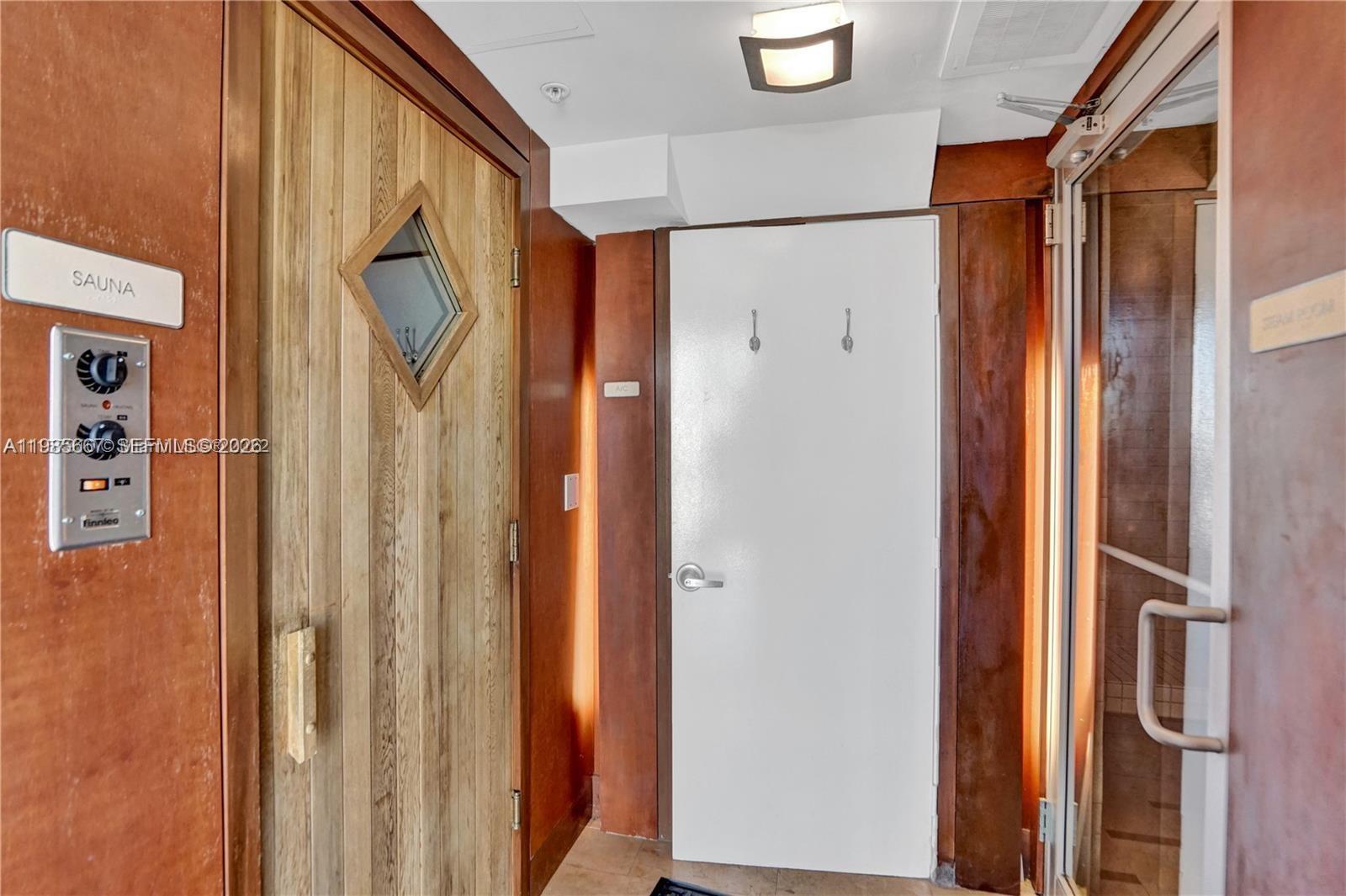 31 Southeast 5th Street, Unit 1110 Miami, FL 33131 - Photo 34 of 61 a bathroom with a glass shower door and a shower