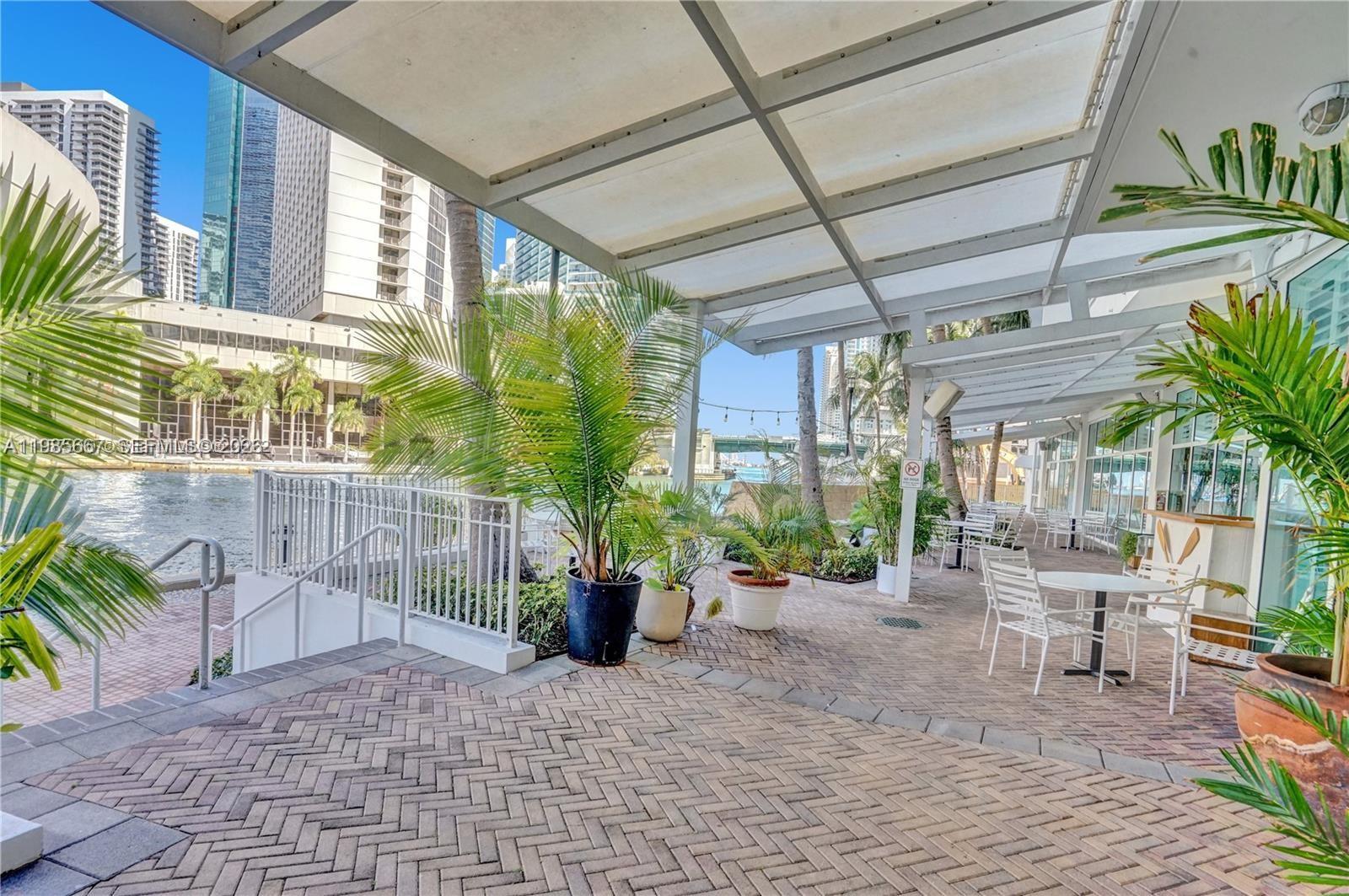 31 Southeast 5th Street, Unit 1110 Miami, FL 33131 - Photo 35 of 61 a view of a patio with chairs and potted plants