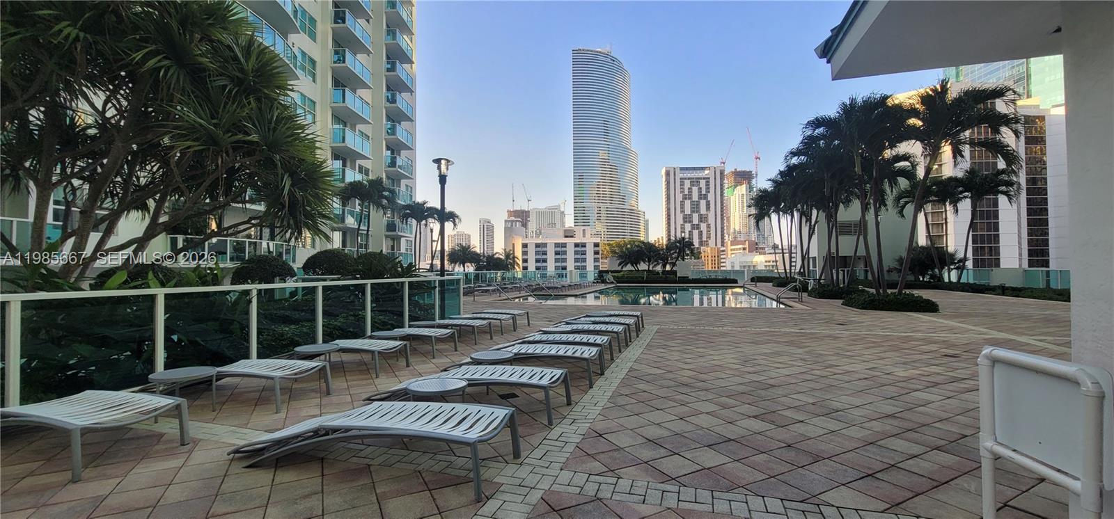 31 Southeast 5th Street, Unit 1110 Miami, FL 33131 - Photo 44 of 61 a view of a patio with couches and potted plants