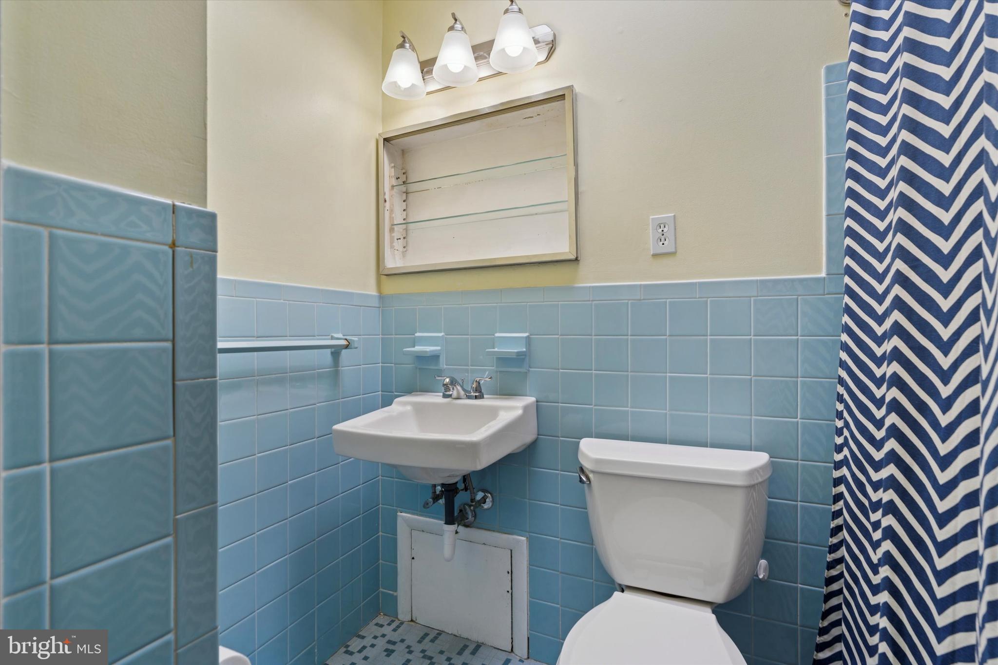 415 Milford Road Broomall, PA 19008 - Photo 13 of 29 a bathroom with a toilet sink and mirror