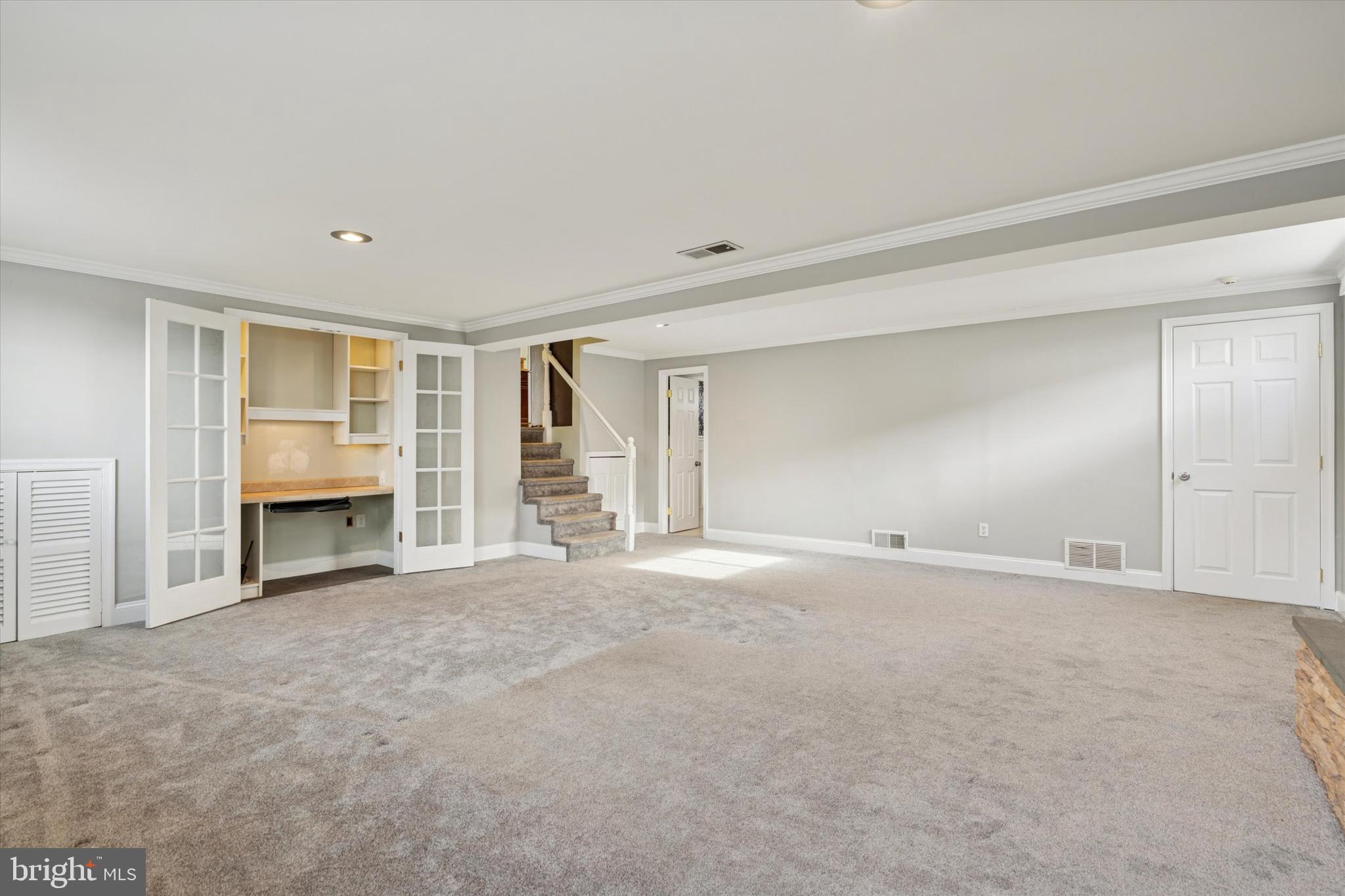 415 Milford Road Broomall, PA 19008 - Photo 18 of 29 a view of an empty room with a fireplace and a window