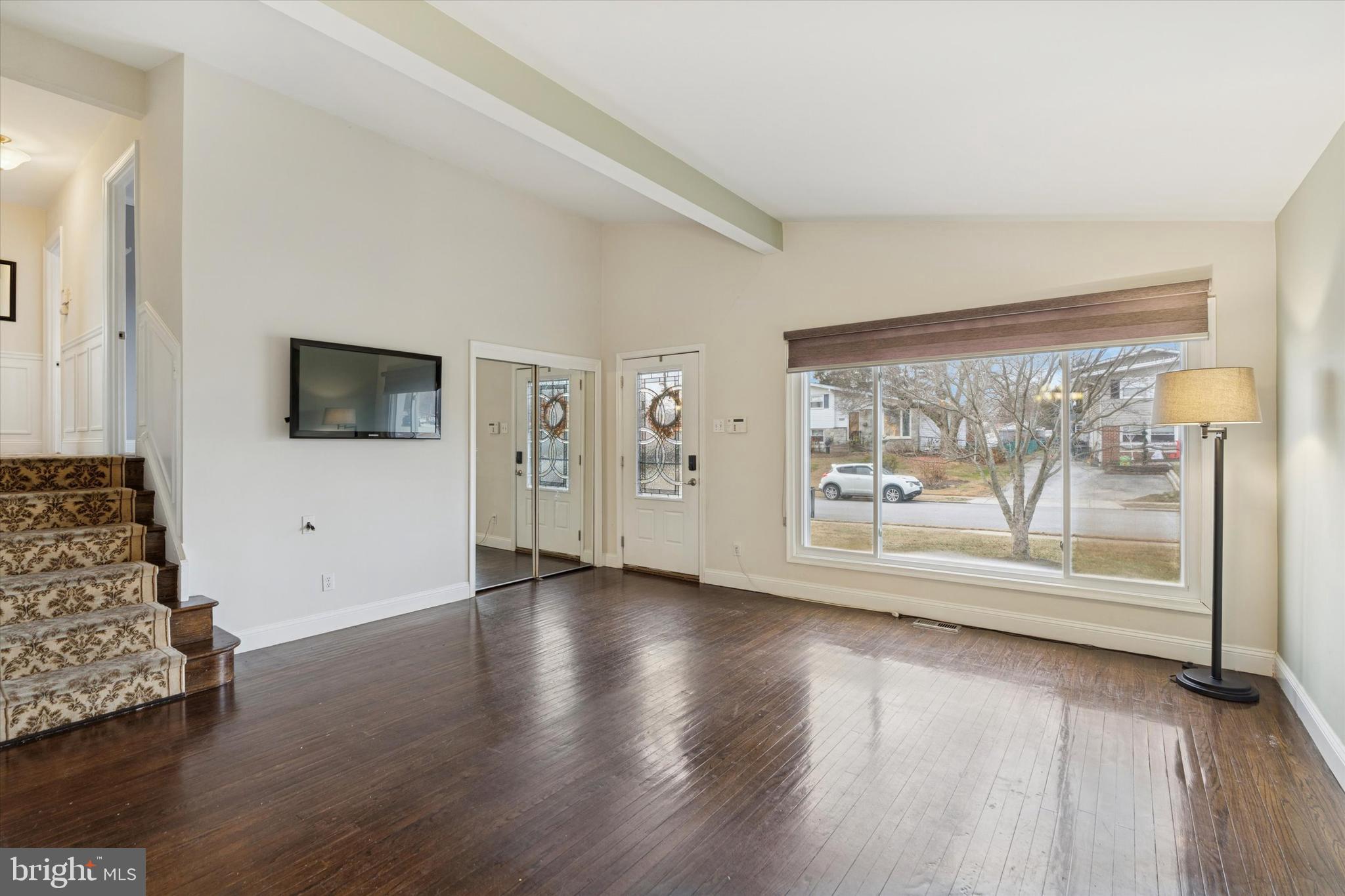 415 Milford Road Broomall, PA 19008 - Photo 5 of 29 a view of an empty room with wooden floor and a window