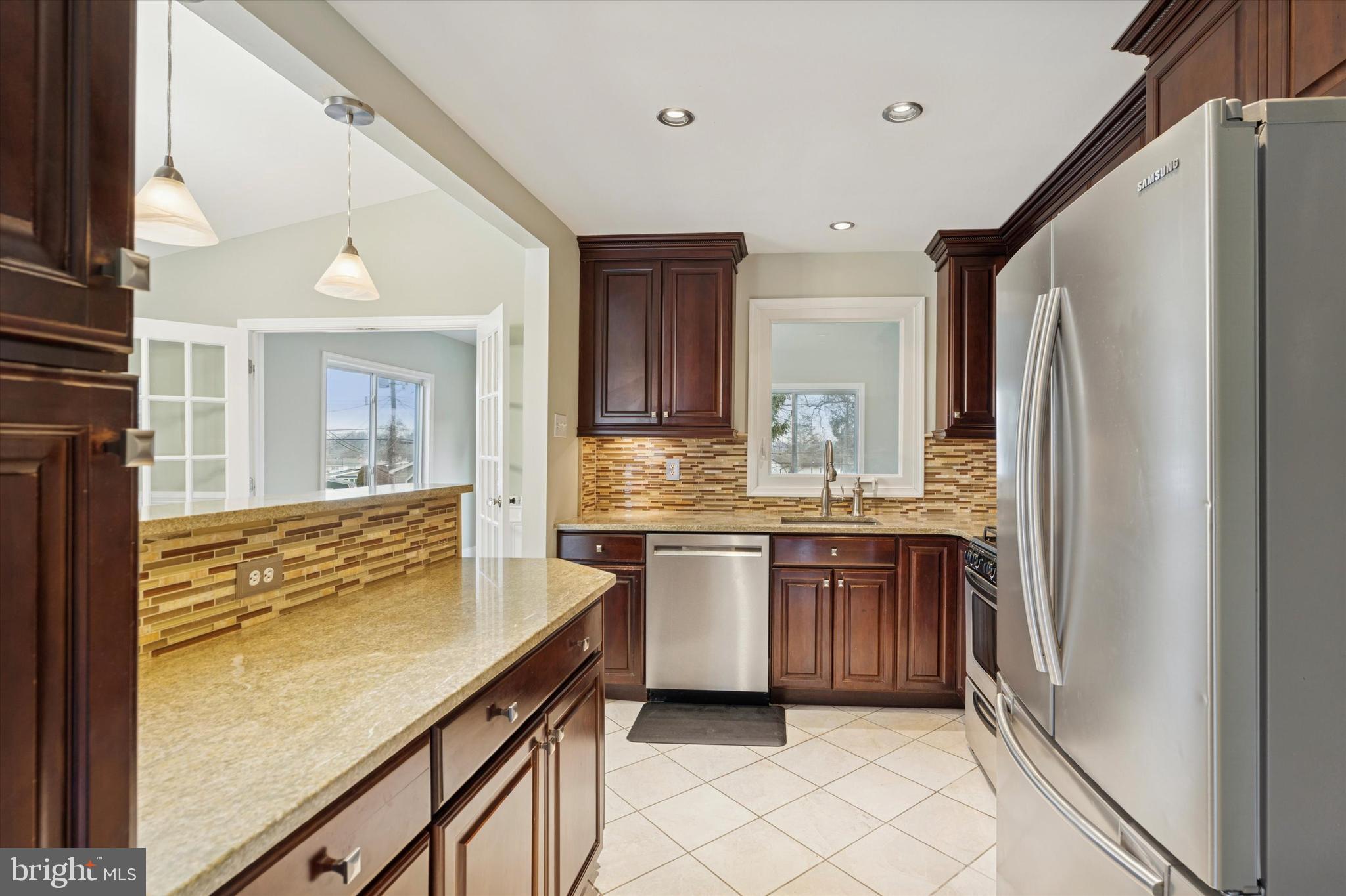 415 Milford Road Broomall, PA 19008 - Photo 9 of 29 a bathroom with a granite countertop sink mirror and cabinets