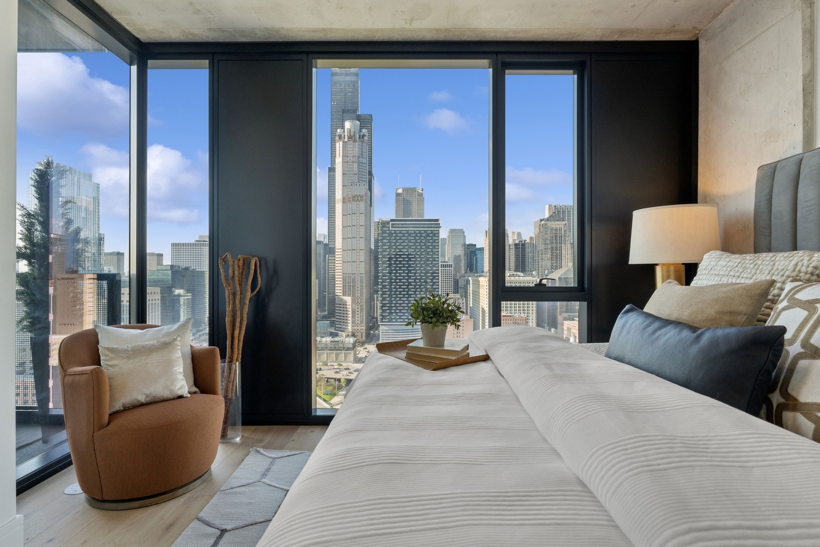 234 West Polk Street, Unit 3510 Chicago, IL 60607 - Photo 13 of 39 a bedroom with furniture and a large window