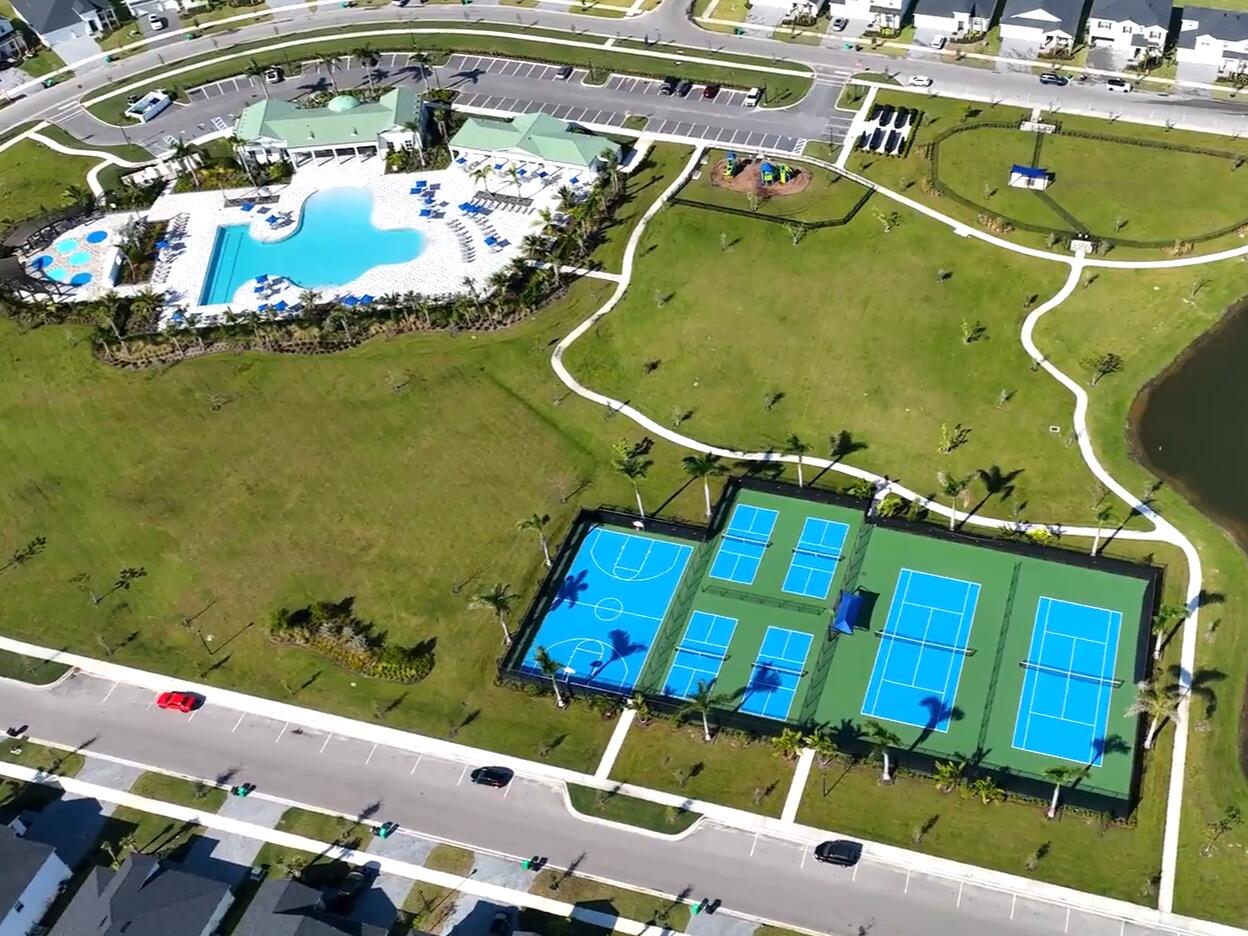 12945 Southwest Forli Way Port St. Lucie, FL 34987 - Photo 12 of 13 an aerial view of a house with a swimming pool