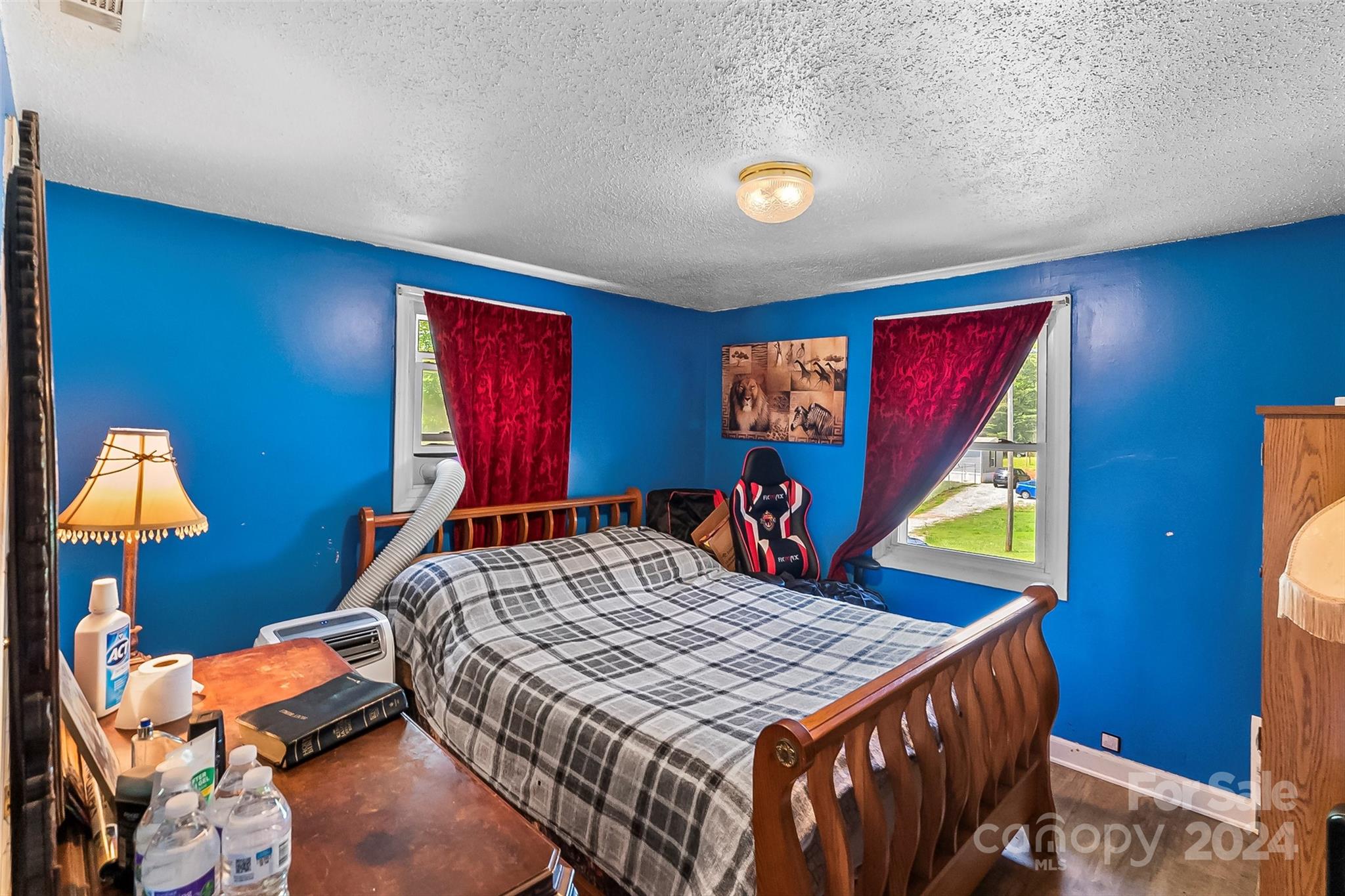 1529 Tatertown Loop Nebo, NC 28761 - Photo 11 of 38 a bedroom with a bed and wooden floor