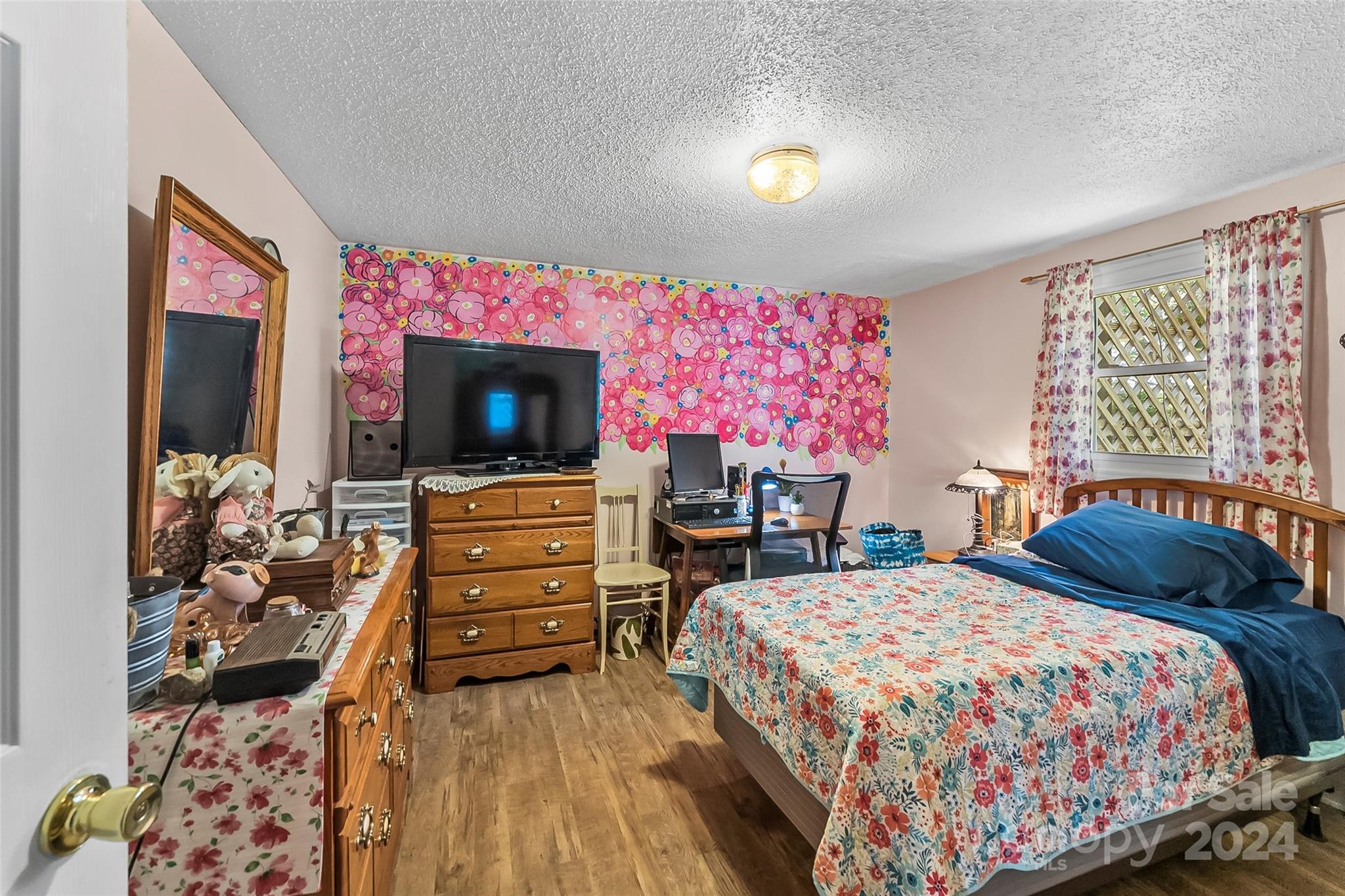 1529 Tatertown Loop Nebo, NC 28761 - Photo 12 of 38 a bedroom with a bed and a flat screen tv