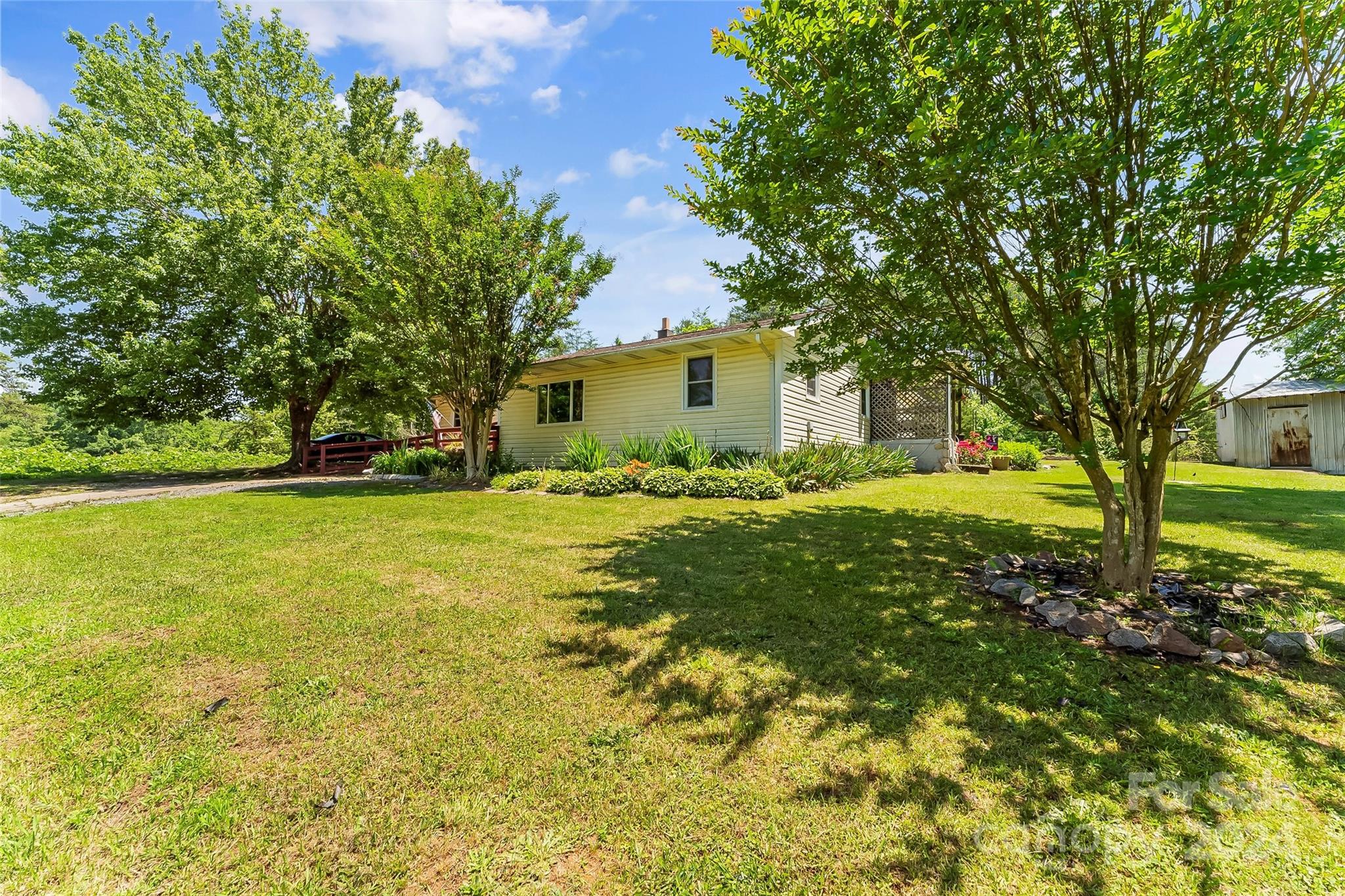 1529 Tatertown Loop Nebo, NC 28761 - Photo 16 of 38 a front view of house with yard and green space