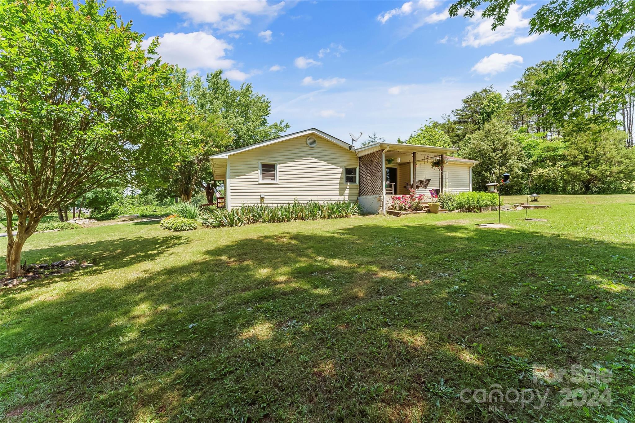 1529 Tatertown Loop Nebo, NC 28761 - Photo 17 of 38 a front view of a house with a yard