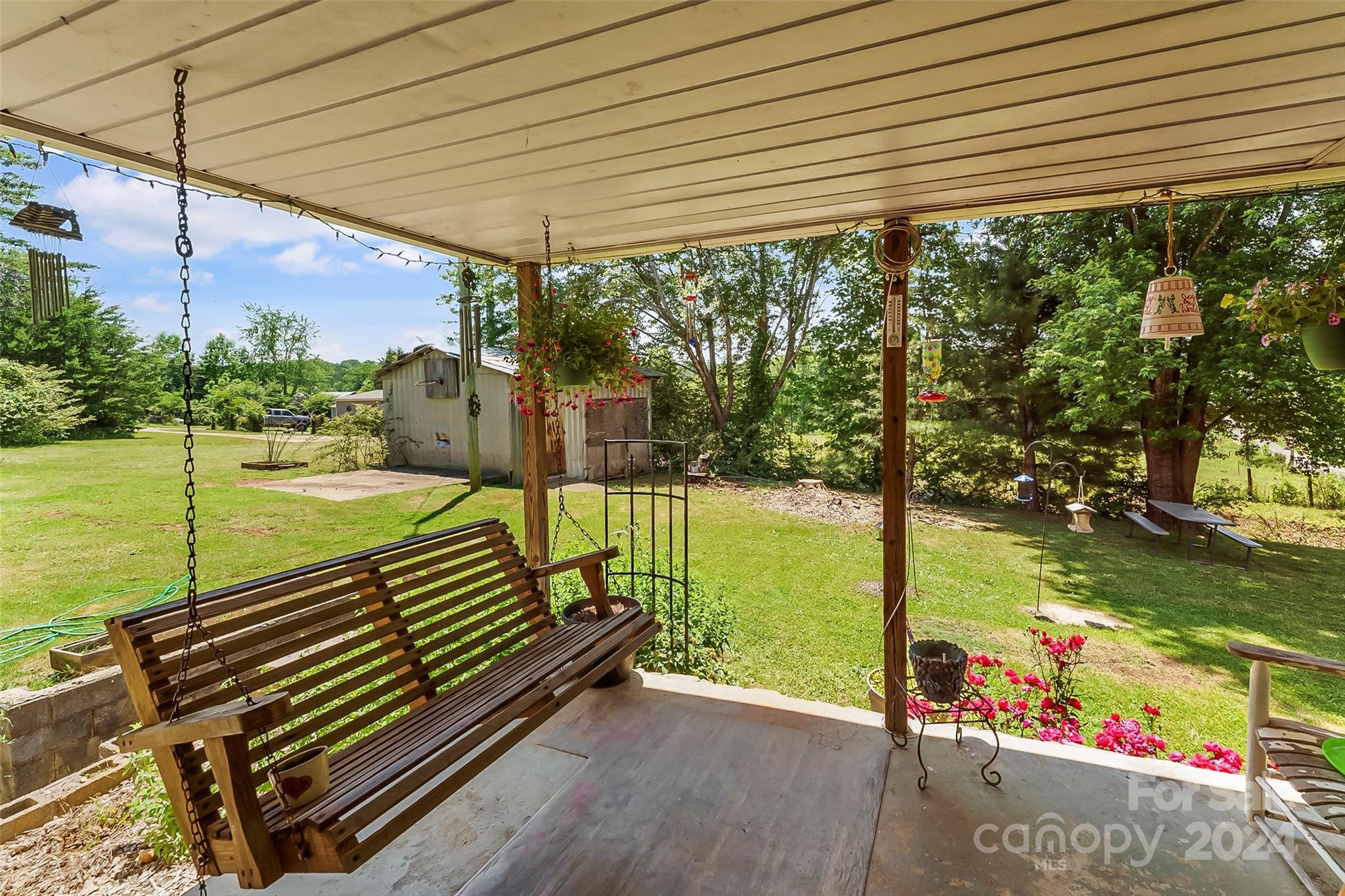 1529 Tatertown Loop Nebo, NC 28761 - Photo 20 of 38 a view of a balcony with floor to ceiling windows and wooden fence