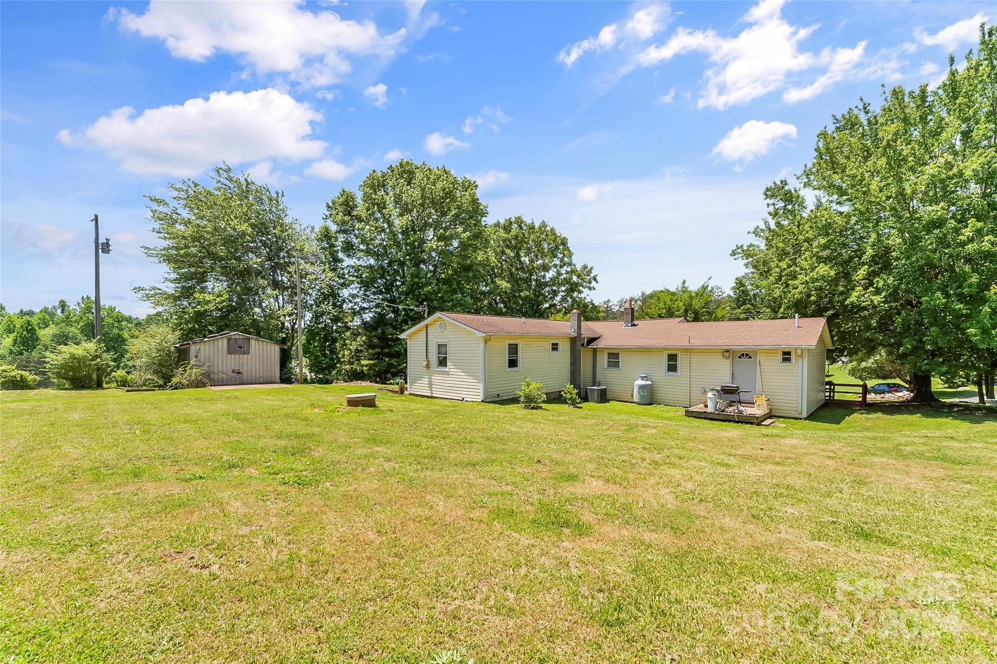 1529 Tatertown Loop Nebo, NC 28761 - Photo 23 of 38 a house with trees in front of it