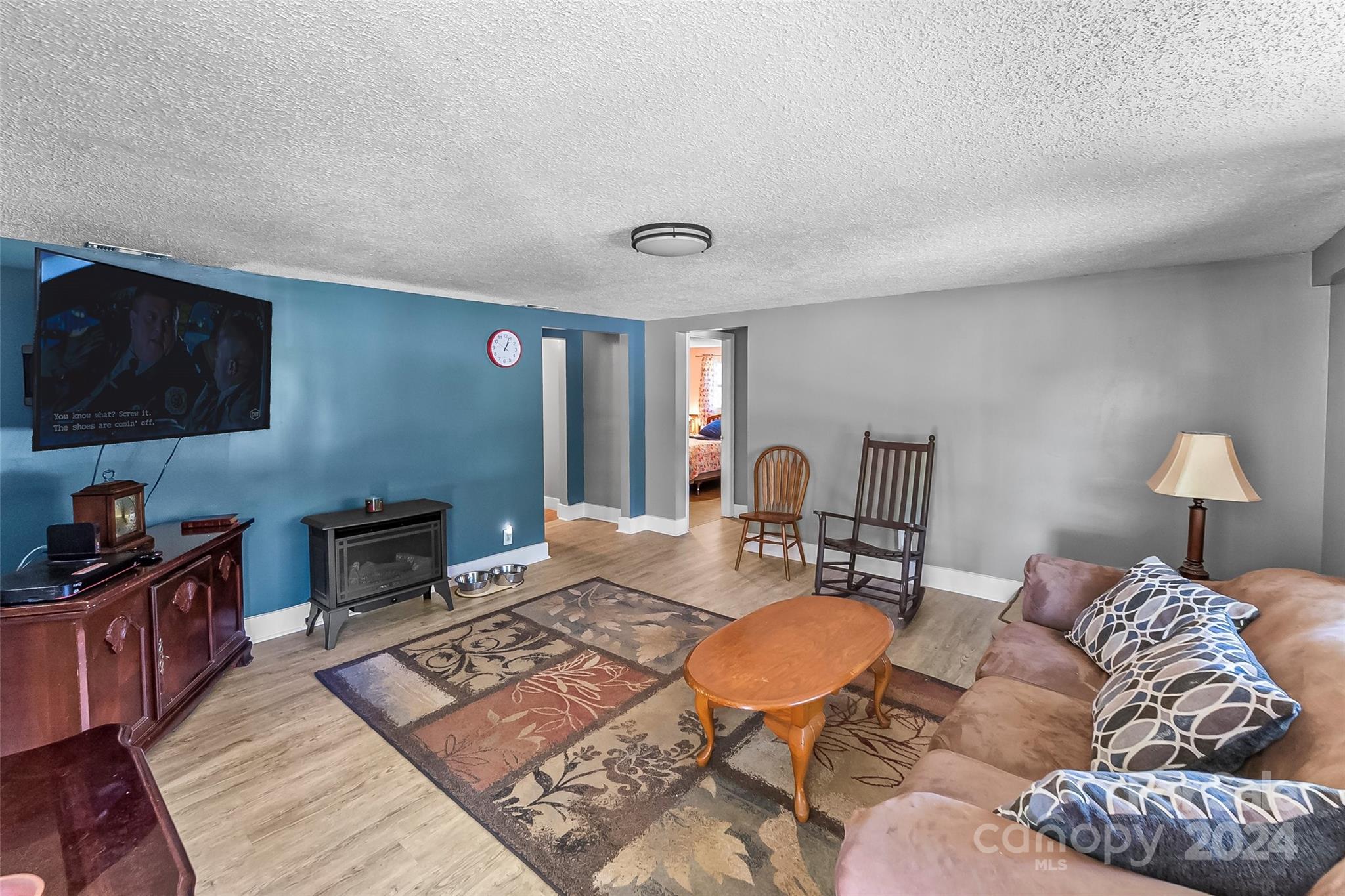 1529 Tatertown Loop Nebo, NC 28761 - Photo 6 of 38 a living room with furniture a rug and a lamp