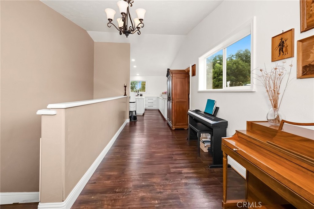 2728 Pentz Road Oroville, CA 95965 - Photo 12 of 52 a living room with furniture a dining table and wooden floor