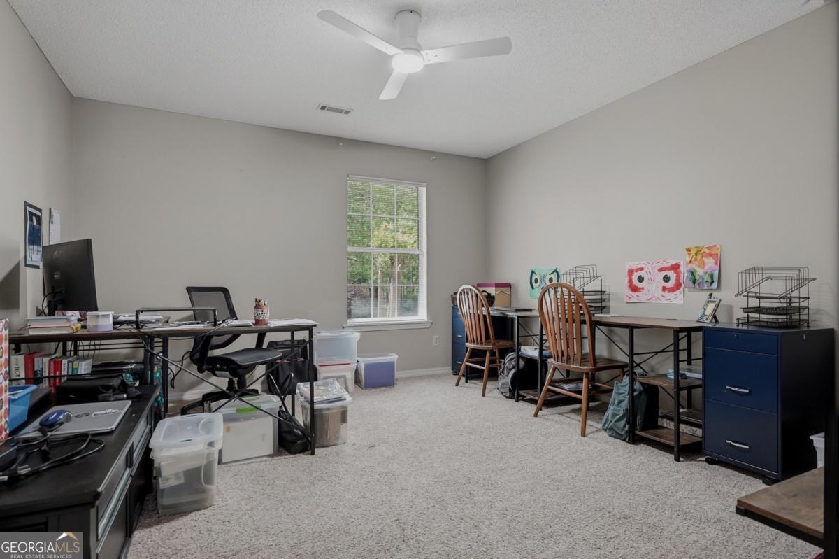 2811 Lullwater Road Tifton, GA 31794 - Photo 20 of 64 a view of a workspace with furniture and a window