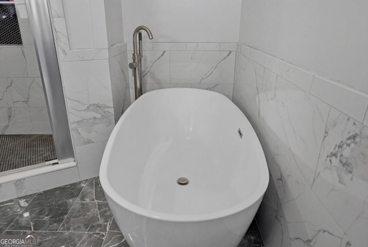 2811 Lullwater Road Tifton, GA 31794 - Photo 32 of 64 a close view of a sink in a bathroom