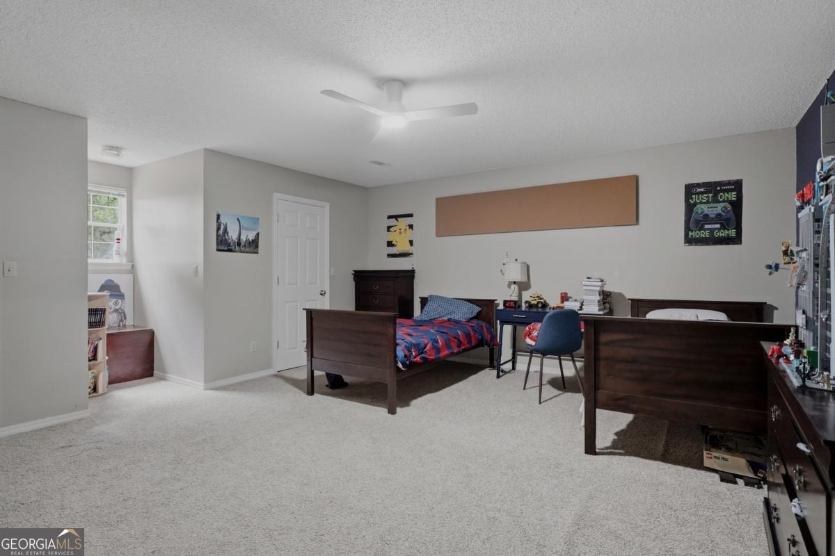 2811 Lullwater Road Tifton, GA 31794 - Photo 35 of 64 a living room with furniture and a piano