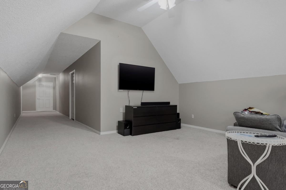 2811 Lullwater Road Tifton, GA 31794 - Photo 48 of 64 a room with a flat screen tv and gym equipment