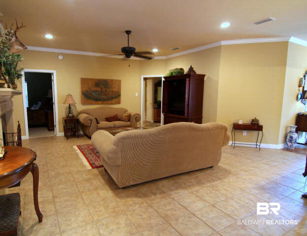 7263 Highpointe Place East Daphne, AL 36527 - Photo 11 of 22 Molding throughout, tile floors in living areas and a beautiful gas fireplace to enjoy on cold winter nights!